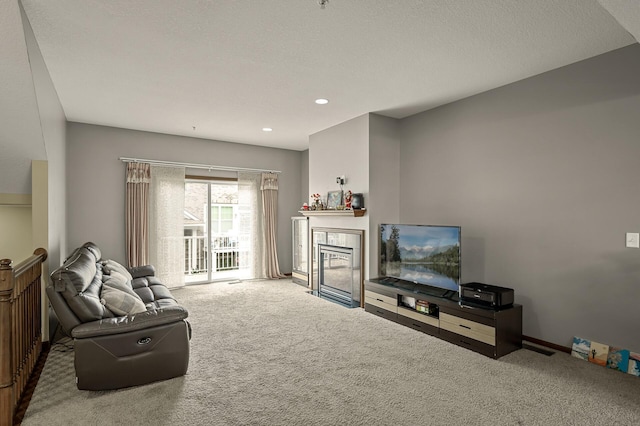 1949 Commonwealth Blvd Unit 2, Chanhassen, MN 55317 - carpeted living area featuring a tiled fireplace and recessed lighting