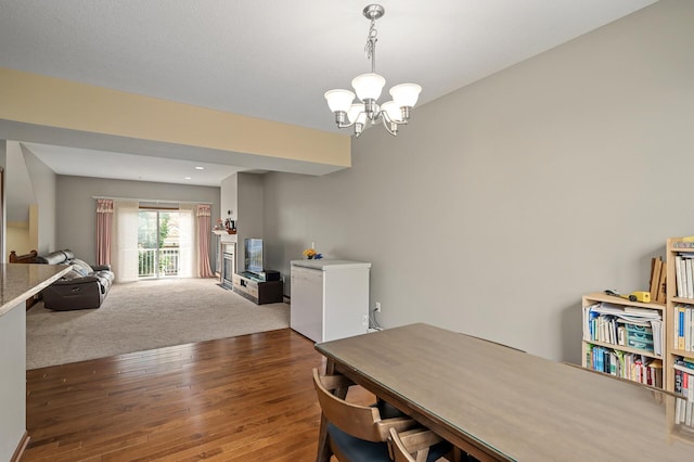 1949 Commonwealth Blvd Unit 2, Chanhassen, MN 55317 - dining room featuring a chandelier, wood finished floors, and carpet