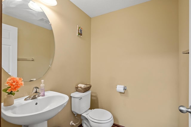 1949 Commonwealth Blvd Unit 2, Chanhassen, MN 55317 - half bathroom featuring a sink and toilet
