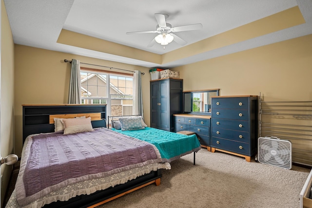 1949 Commonwealth Blvd Unit 2, Chanhassen, MN 55317 - carpeted bedroom featuring a tray ceiling and a ceiling fan