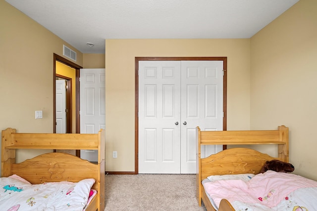 1949 Commonwealth Blvd Unit 2, Chanhassen, MN 55317 - carpeted bedroom featuring a closet and baseboards