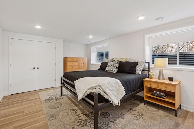 4450 Forest Lake Lndg, Orono, MN 55364 - bedroom with light wood-style flooring, recessed lighting, and a closet