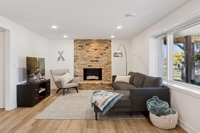 4450 Forest Lake Lndg, Orono, MN 55364 - living area with light wood-style floors, a fireplace, and recessed lighting