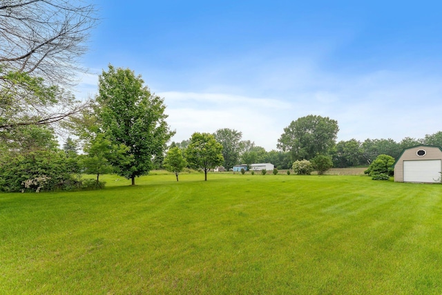 21233 Pierce St NE, East Bethel, MN 55011 - view of grassy yard with a detached garage and a storage unit