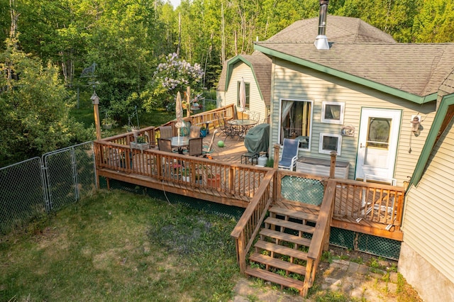 3382 Breezy Point Rd, Greenwood Twp, MN 55790 - deck featuring area for grilling, a forest view, and outdoor dining area