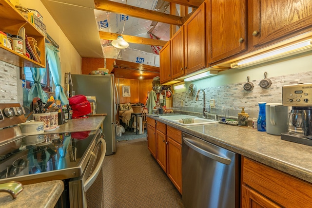 3382 Breezy Point Rd, Greenwood Twp, MN 55790 - kitchen with appliances with stainless steel finishes, a sink, brown cabinetry, and carpet floors
