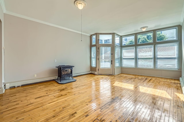 774 Capitol Hts, Saint Paul, MN 55103 - unfurnished living room featuring a wood stove, crown molding, light wood-style floors, baseboard heating, and a baseboard radiator