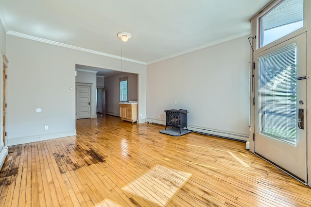 774 Capitol Hts, Saint Paul, MN 55103 - unfurnished living room featuring baseboard heating, light wood-style flooring, a wood stove, and ornamental molding