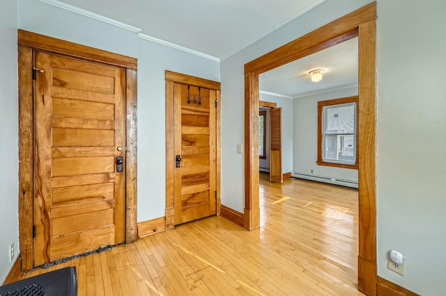 774 Capitol Hts, Saint Paul, MN 55103 - foyer entrance with a baseboard radiator, light wood finished floors, and ornamental molding