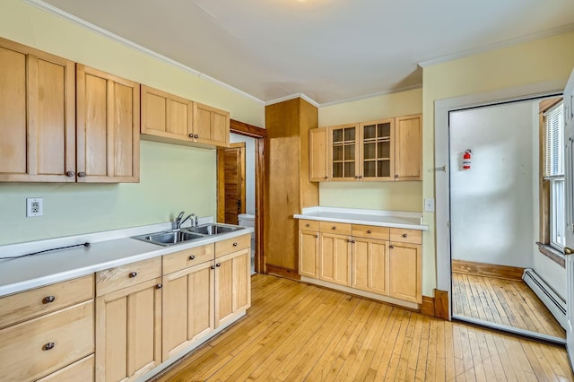 774 Capitol Hts, Saint Paul, MN 55103 - kitchen with light brown cabinetry, ornamental molding, and light wood finished floors