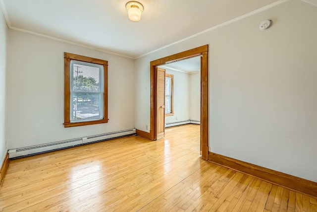 774 Capitol Hts, Saint Paul, MN 55103 - unfurnished room featuring a baseboard heating unit, ornamental molding, a smoke detector, and light wood finished floors