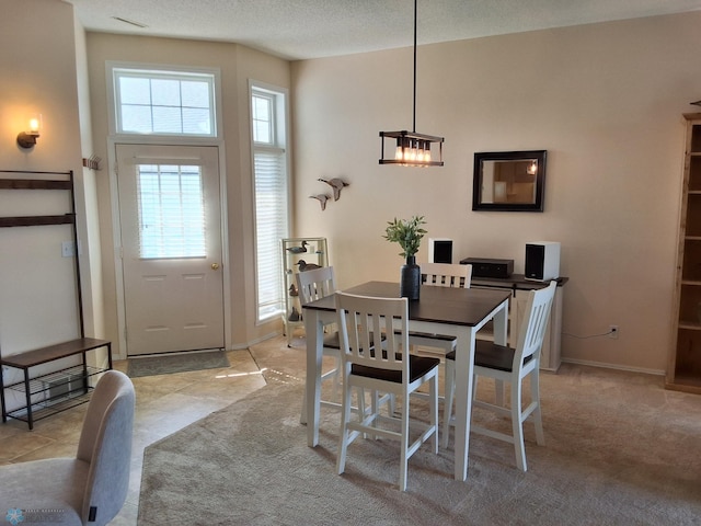 3307 38th St S, Moorhead, MN 56560 - dining area with light carpet, a chandelier, and baseboards