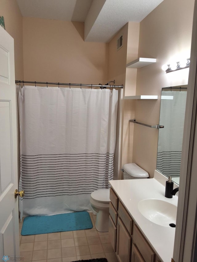 3307 38th St S, Moorhead, MN 56560 - bathroom with vanity, toilet, tile patterned flooring, and shower / tub combo with curtain