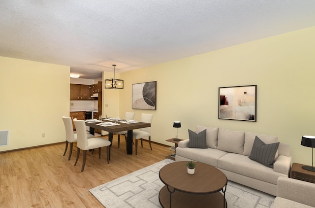 7880 Rimbley Rd, Woodbury, MN 55125 - living room featuring light wood-type flooring and baseboards