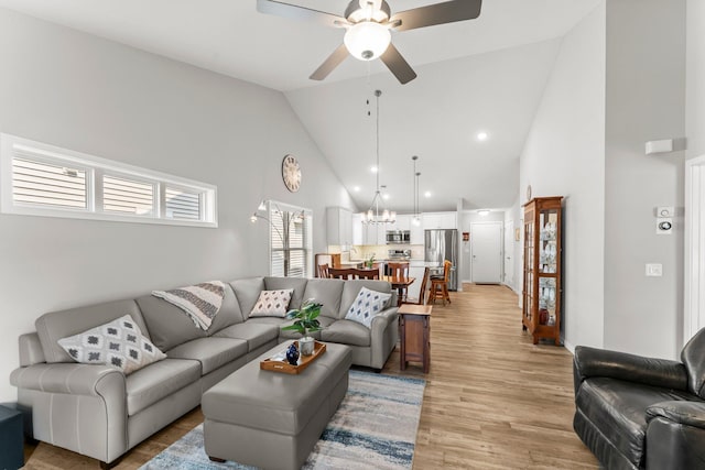11164 184th Cir NW, Elk River, MN 55330 - living area featuring a ceiling fan, high vaulted ceiling, a chandelier, light wood-style flooring, and recessed lighting