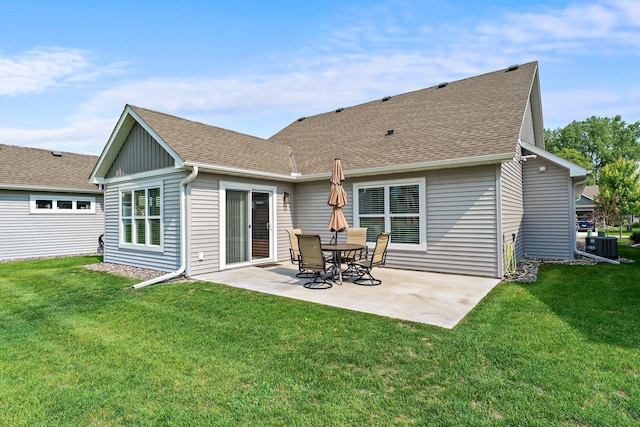 11164 184th Cir NW, Elk River, MN 55330 - back of property with a patio area, a lawn, and a shingled roof