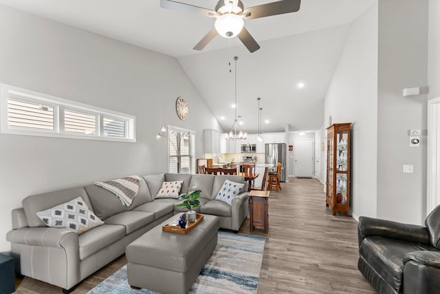 11164 184th Cir NW, Elk River, MN 55330 - living room with a ceiling fan, high vaulted ceiling, a chandelier, light wood-style flooring, and recessed lighting