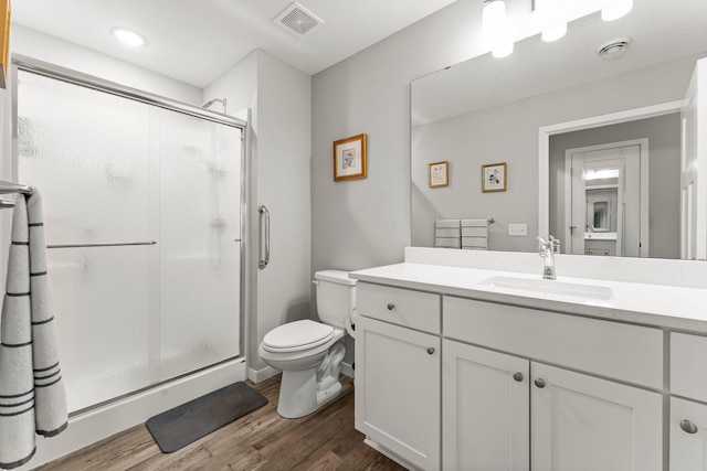 11164 184th Cir NW, Elk River, MN 55330 - full bathroom featuring a shower stall, vanity, and wood finished floors