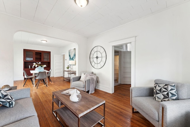 786 Iglehart Ave, Saint Paul, MN 55104 - living room with crown molding, hardwood / wood-style floors, and arched walkways