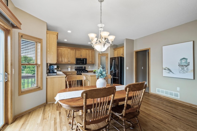 15350 Xkimo St NW, Ramsey, MN 55303 - dining space featuring a chandelier, light wood-type flooring, and recessed lighting