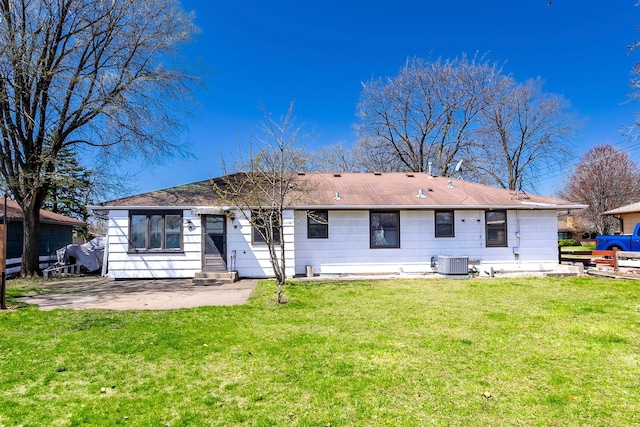 7533 16th Ave S, Richfield, MN 55423 - rear view of property with central AC, a yard, a patio area, and entry steps