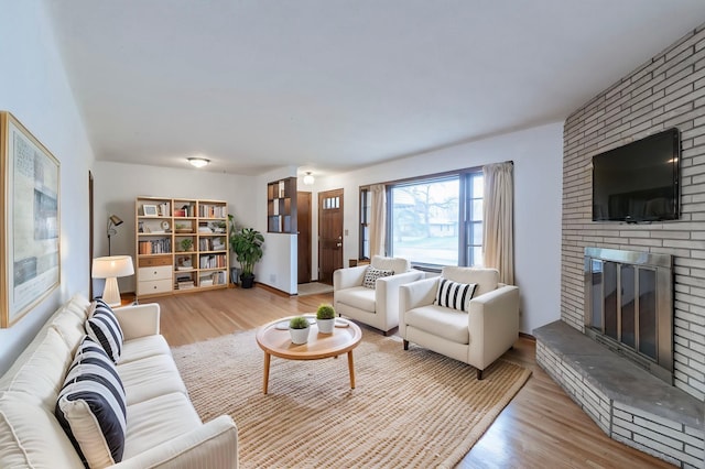 7533 16th Ave S, Richfield, MN 55423 - living room featuring a brick fireplace and wood finished floors
