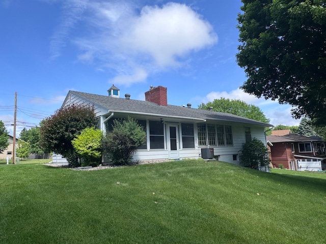 2814 Lakeview Dr, Fergus Falls, MN 56537 - rear view of property featuring a chimney and a lawn