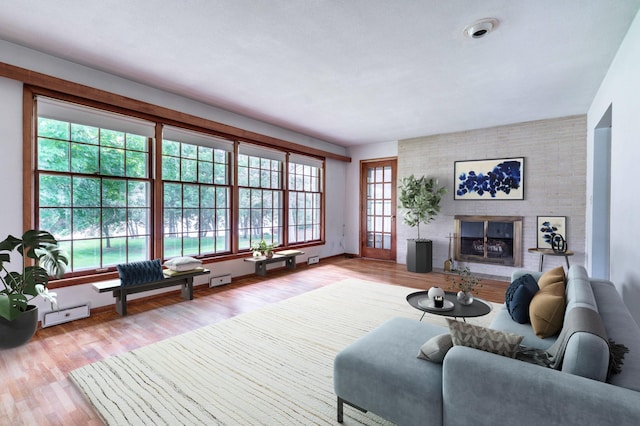 2814 Lakeview Dr, Fergus Falls, MN 56537 - living area with a brick fireplace and wood finished floors