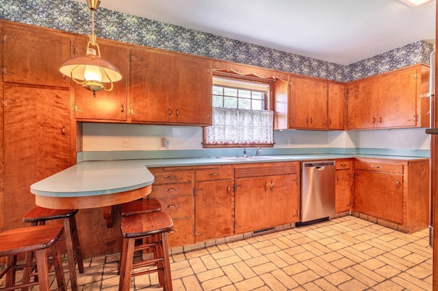 2814 Lakeview Dr, Fergus Falls, MN 56537 - kitchen with dishwasher, brick patterned floors, brown cabinetry, light countertops, and wallpapered walls