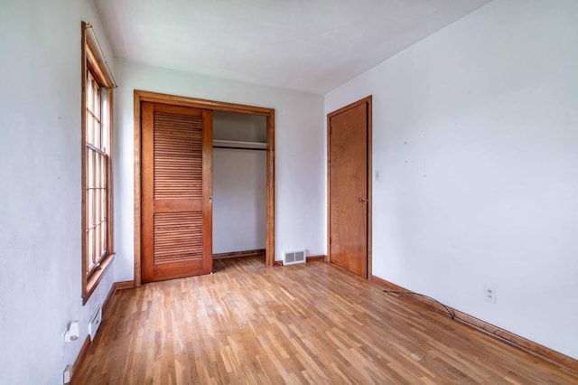 2814 Lakeview Dr, Fergus Falls, MN 56537 - unfurnished bedroom with light wood-type flooring and a closet
