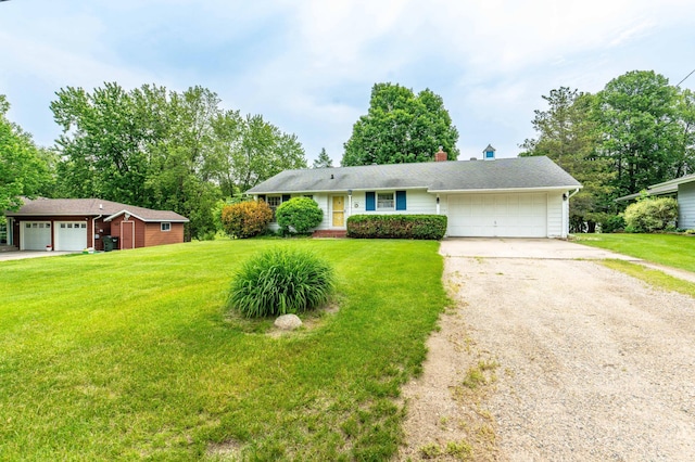 2814 Lakeview Dr, Fergus Falls, MN 56537 - ranch-style house with an attached garage, driveway, a front lawn, and a chimney