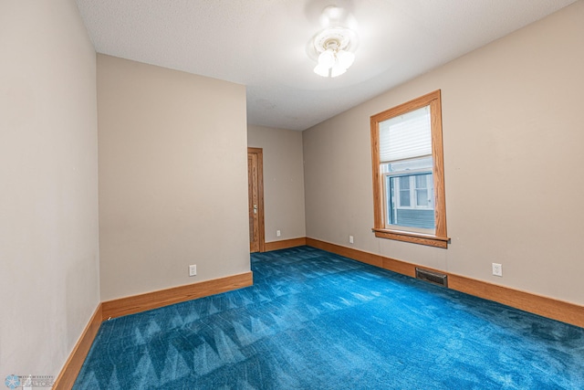 1023 12th St N, Fargo, ND 58102 - empty room with carpet floors and baseboards