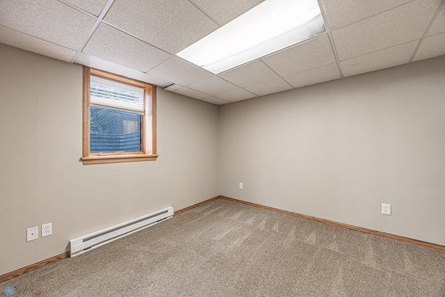 1023 12th St N, Fargo, ND 58102 - carpeted spare room with a baseboard heating unit and a drop ceiling