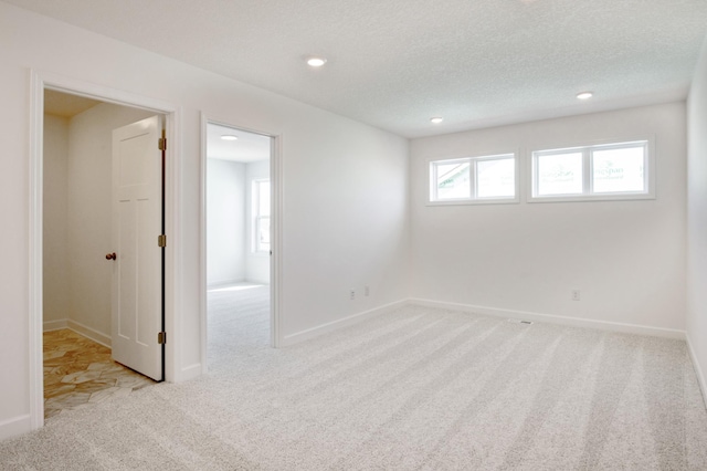 2508 Downing Ave, Shakopee, MN 55379 - spare room with carpet, recessed lighting, baseboards, and a textured ceiling