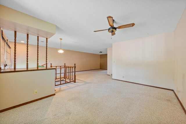 635 5th St, Windom, MN 56101 - carpeted empty room featuring a ceiling fan and baseboards