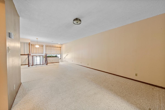 635 5th St, Windom, MN 56101 - empty room featuring carpet and baseboards