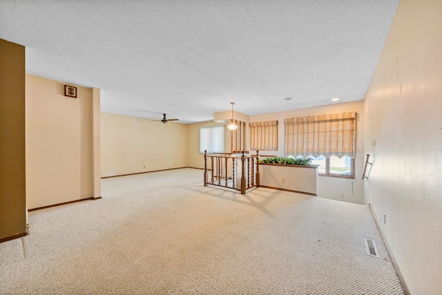 635 5th St, Windom, MN 56101 - unfurnished room featuring carpet floors and a ceiling fan