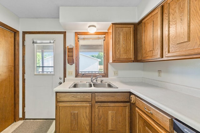 635 5th St, Windom, MN 56101 - kitchen featuring brown cabinetry and light countertops