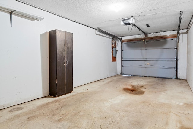 635 5th St, Windom, MN 56101 - garage featuring a garage door opener and electric panel