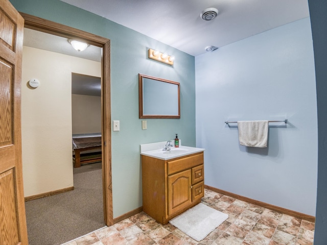 22152 Polaris Rd NW, Puposky, MN 56667 - bathroom featuring vanity and stone finish flooring