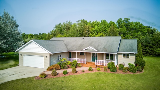 22152 Polaris Rd NW, Puposky, MN 56667 - view of front of property with a porch, a garage, concrete driveway, and a front lawn