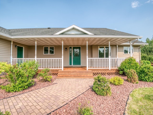 22152 Polaris Rd NW, Puposky, MN 56667 - property entrance with roof with shingles and a porch