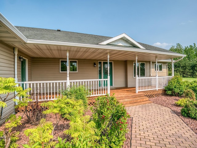 22152 Polaris Rd NW, Puposky, MN 56667 - property entrance featuring roof with shingles and a porch