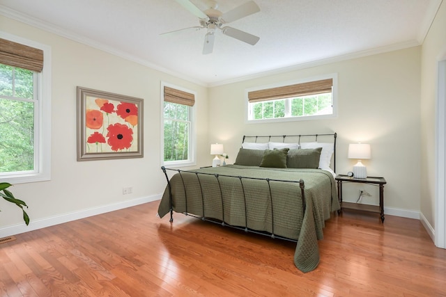 3543 Eben Way, Stillwater, MN 55082 - bedroom with light wood-style floors, ornamental molding, baseboards, and a ceiling fan
