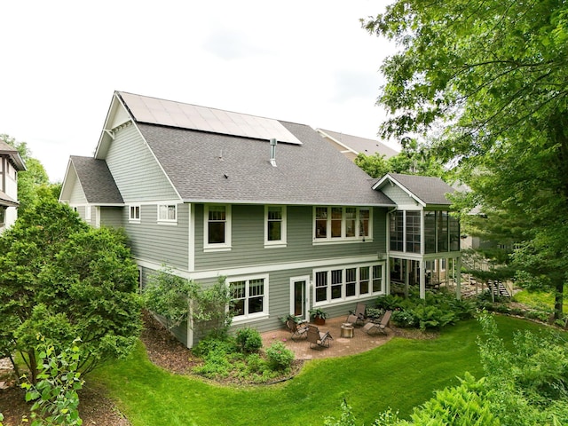 3543 Eben Way, Stillwater, MN 55082 - back of house with a patio area, roof with shingles, a sunroom, and a lawn