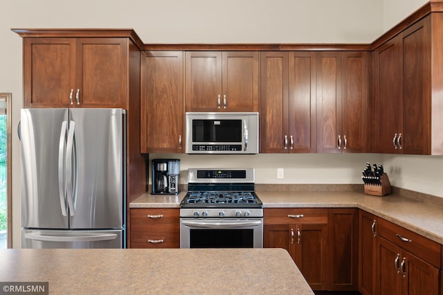 5261 Fenson Ct N, Hugo, MN 55038 - kitchen with appliances with stainless steel finishes and light countertops