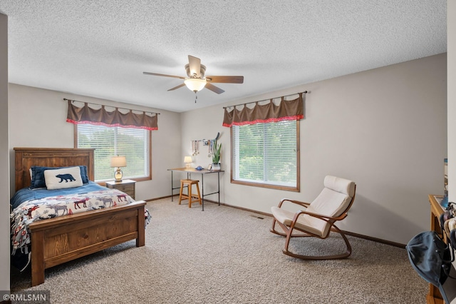 5261 Fenson Ct N, Hugo, MN 55038 - carpeted bedroom featuring a textured ceiling and a ceiling fan