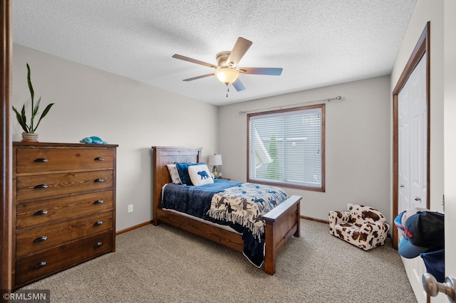 5261 Fenson Ct N, Hugo, MN 55038 - bedroom featuring light colored carpet, a textured ceiling, a ceiling fan, and a closet