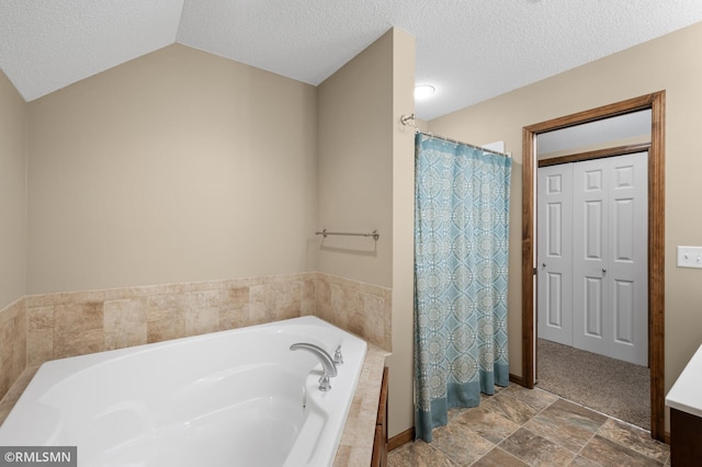 5261 Fenson Ct N, Hugo, MN 55038 - full bath with a bath, vaulted ceiling, a textured ceiling, stone finish floors, and curtained shower