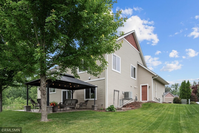 5261 Fenson Ct N, Hugo, MN 55038 - back of house with a gazebo, a yard, a patio area, and outdoor lounge area